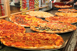 Photo: Pizzas ready to serve for lunch slices